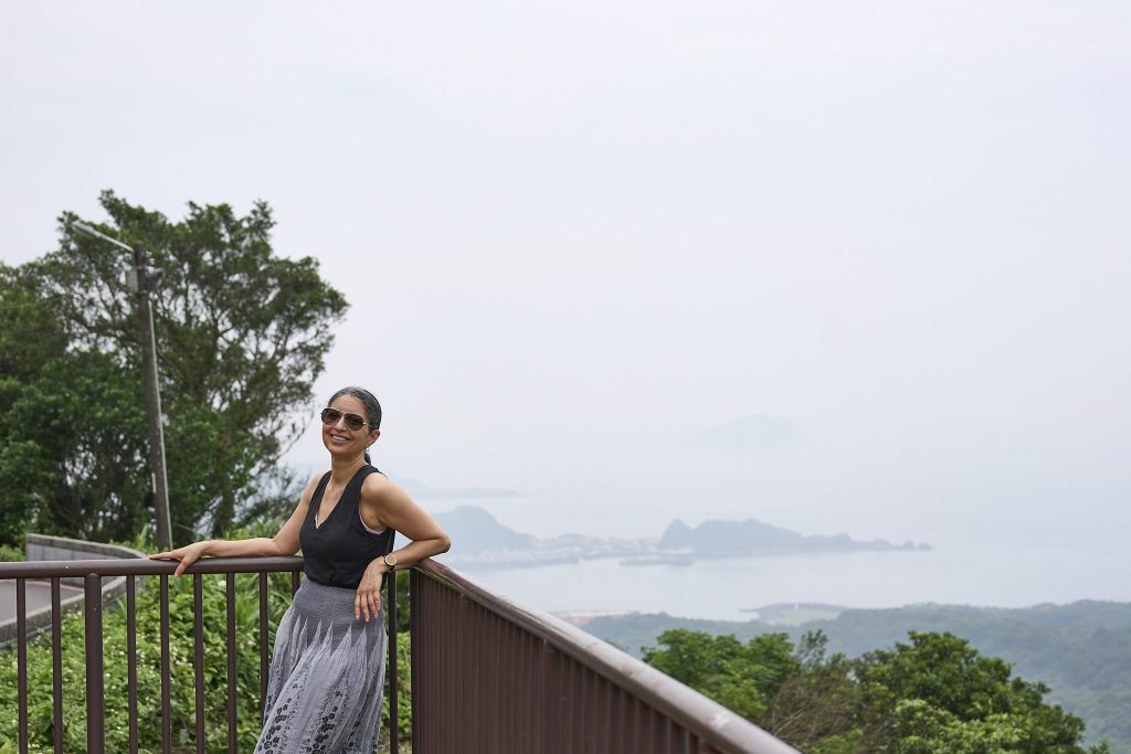 angela Acosta standing on a balcony. overnight stay in jiufen, taiwan