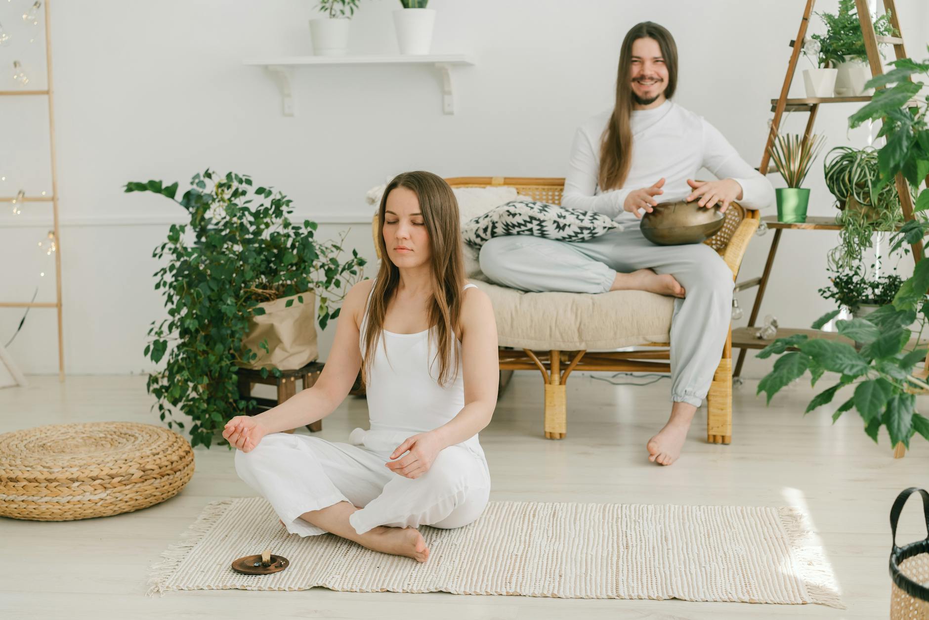 a couple meditating at home