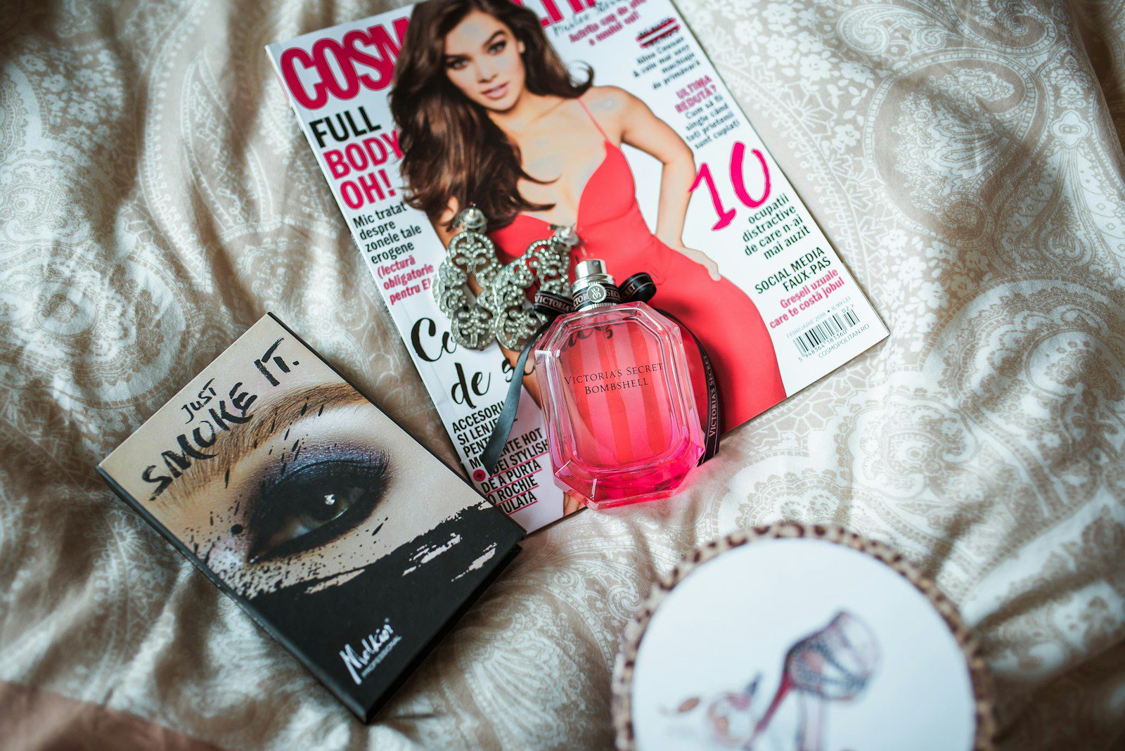Cosmopolitan magazine on white textile. Redefining beauty standards.