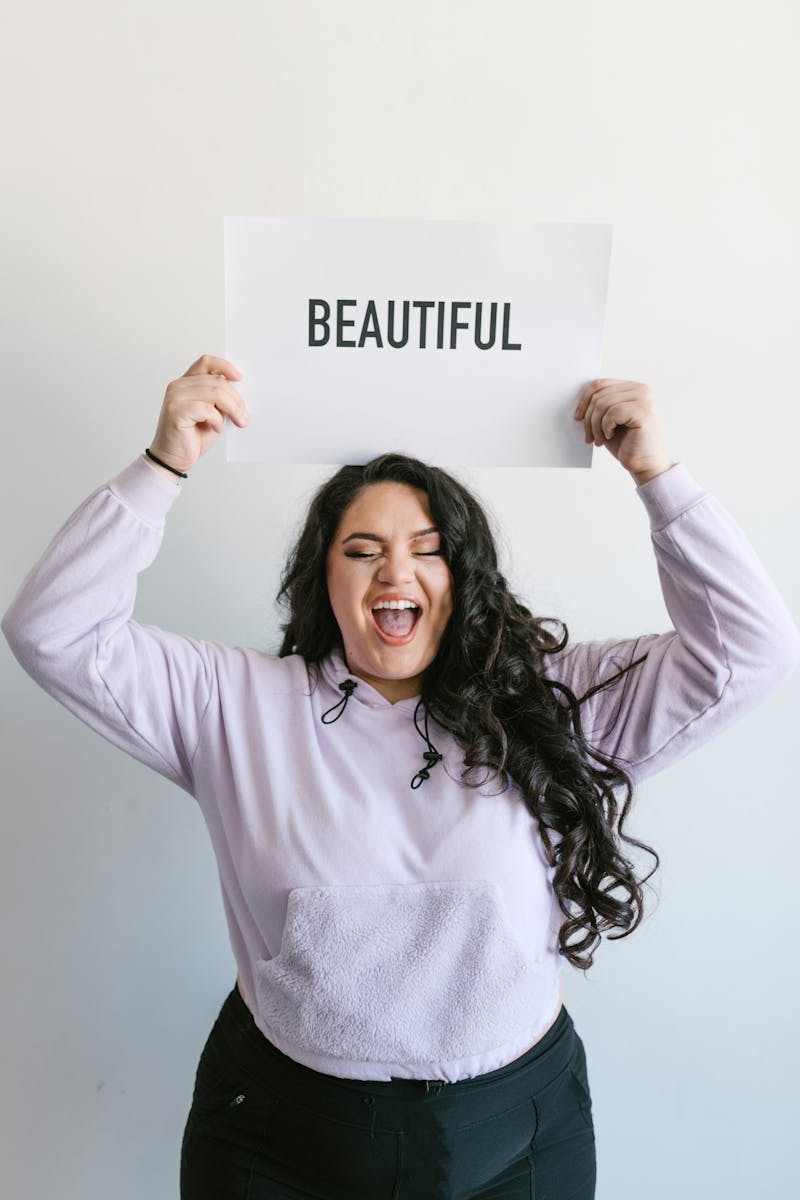 Stop Charging Your worth - Woman in Long Sleeve Shirt Holding a Paper