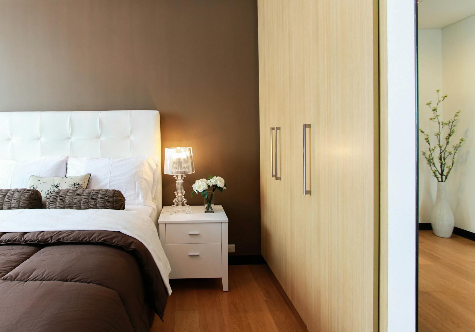 Essential Bedroom Organizers White Bed Next to White Accent Table