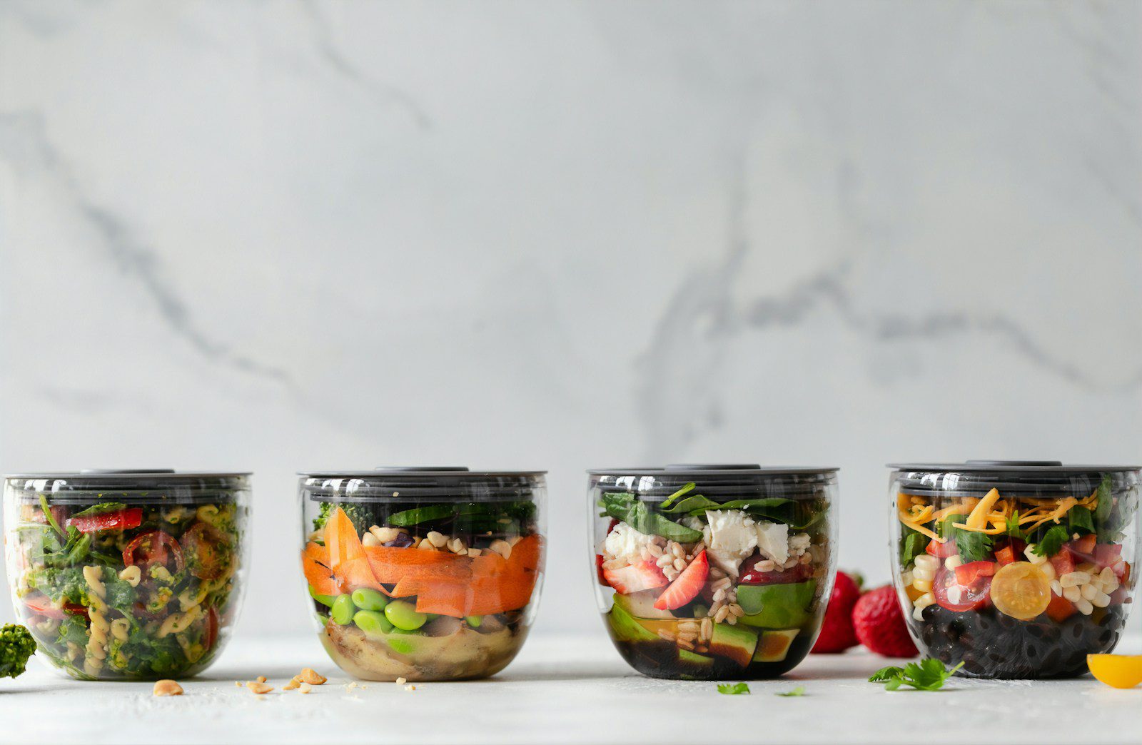 four clear plastic bowls with vegetables - meal prep ideas article